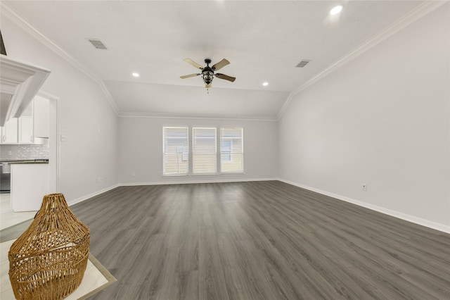 unfurnished living room featuring lofted ceiling, visible vents, and crown molding