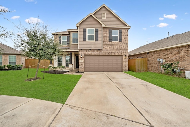 view of front facade with concrete driveway, brick siding, a front lawn, and fence