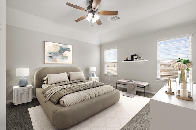 bedroom featuring lofted ceiling, visible vents, carpet flooring, ceiling fan, and baseboards