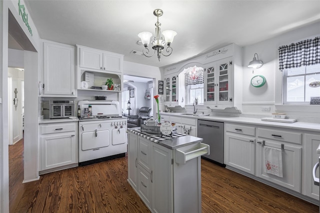 kitchen with white gas range, white cabinets, dishwasher, and decorative light fixtures