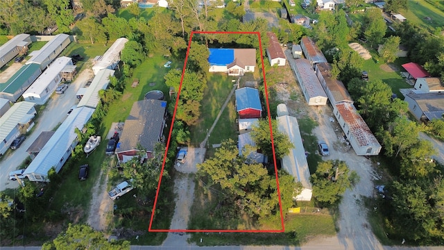 birds eye view of property with a residential view