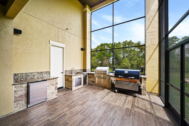 sunroom with a sink