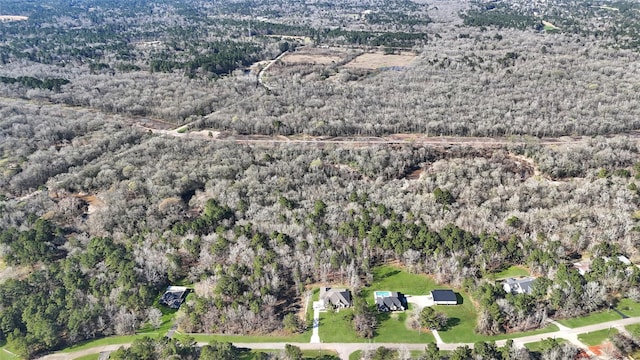 drone / aerial view with a view of trees