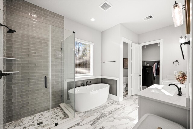 full bath with marble finish floor, visible vents, a shower stall, and toilet