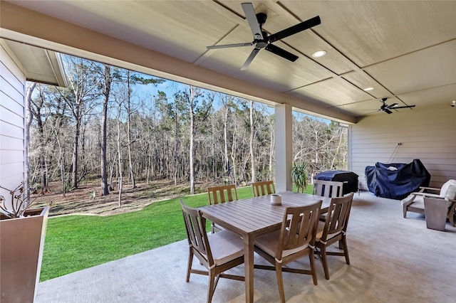 view of patio / terrace with a ceiling fan and outdoor dining space