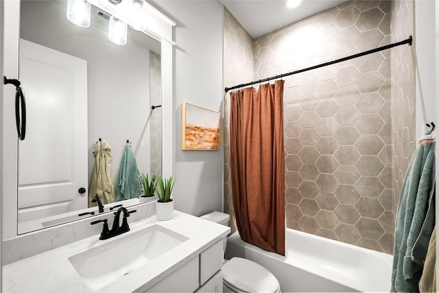 full bath with vanity, toilet, and shower / bath combo with shower curtain