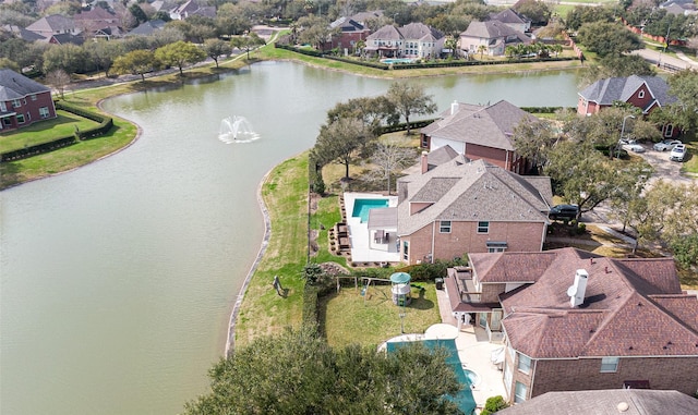 aerial view featuring a water view and a residential view