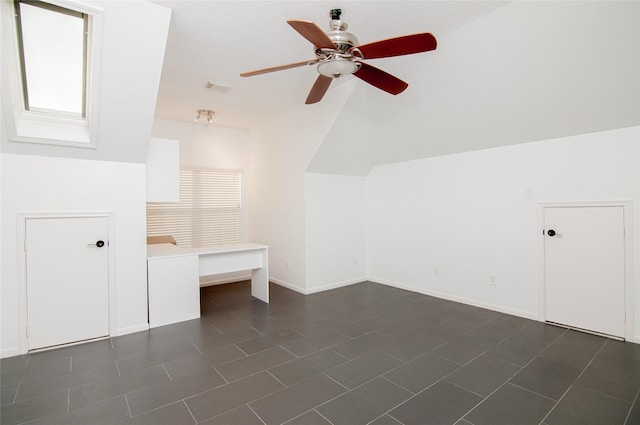 bonus room with lofted ceiling, visible vents, baseboards, and ceiling fan