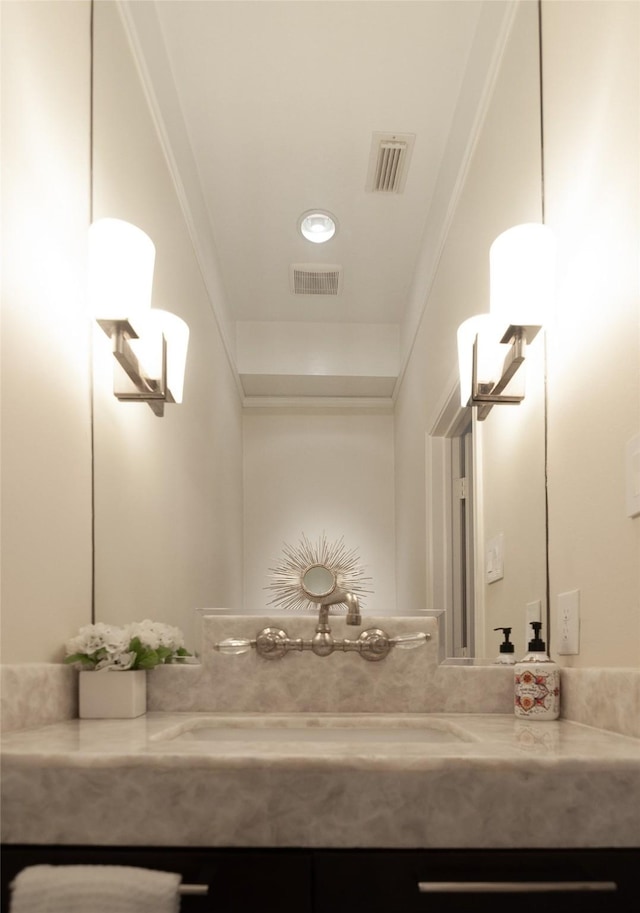 bathroom with visible vents and vanity