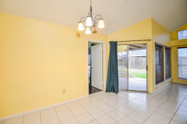 empty room featuring vaulted ceiling, light tile patterned flooring, a wealth of natural light, and an inviting chandelier