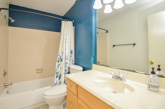 bathroom featuring shower / bath combination with curtain, vanity, toilet, and a textured ceiling