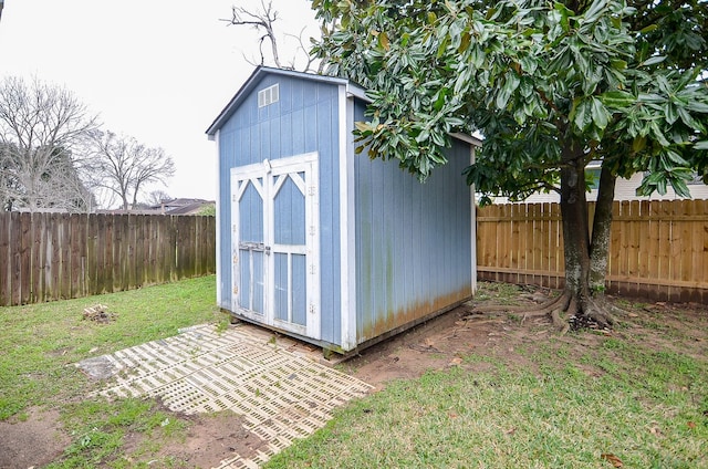 view of shed featuring a fenced backyard