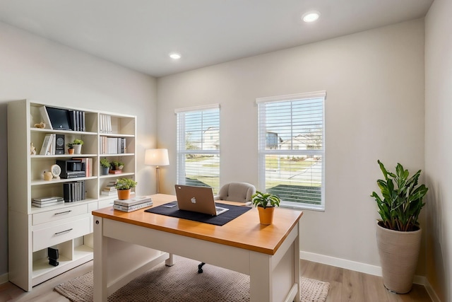 home office featuring baseboards, recessed lighting, and light wood-style floors