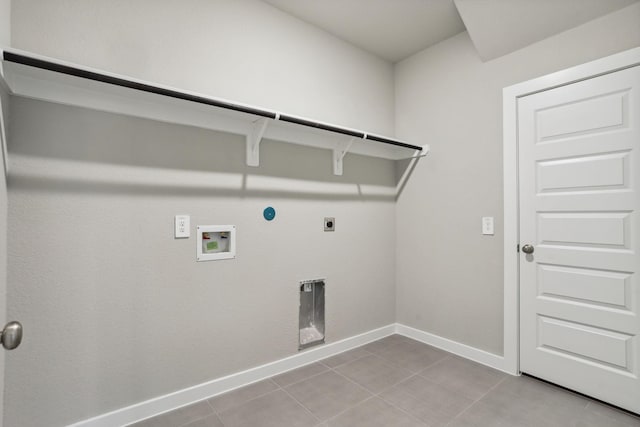 laundry area with light tile patterned flooring, laundry area, washer hookup, baseboards, and electric dryer hookup