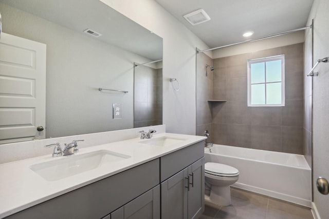 full bathroom with washtub / shower combination, double vanity, a sink, and visible vents