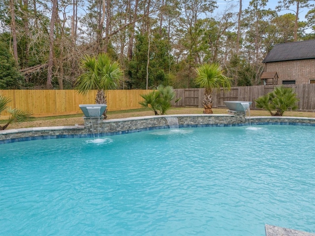 view of swimming pool with a fenced backyard and a fenced in pool