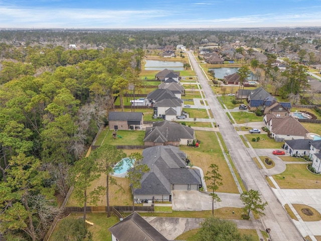 birds eye view of property featuring a water view and a residential view