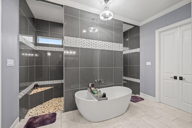 full bathroom with baseboards, walk in shower, a freestanding tub, and crown molding