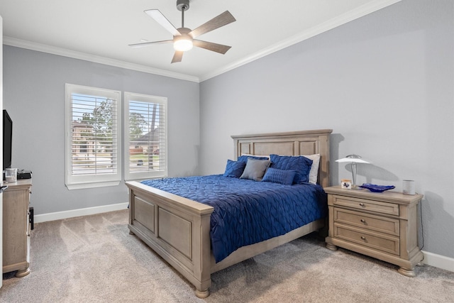 bedroom featuring crown molding, ceiling fan, baseboards, and light colored carpet