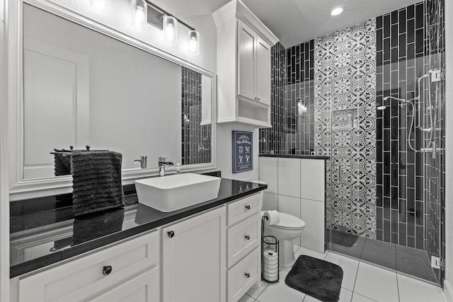 full bathroom with toilet, vanity, walk in shower, and tile patterned floors