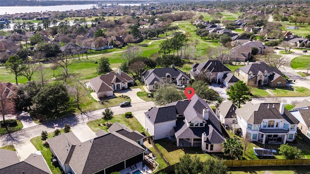 bird's eye view with a water view and a residential view