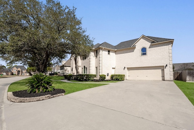 french provincial home featuring a garage, driveway, a residential view, and a front lawn