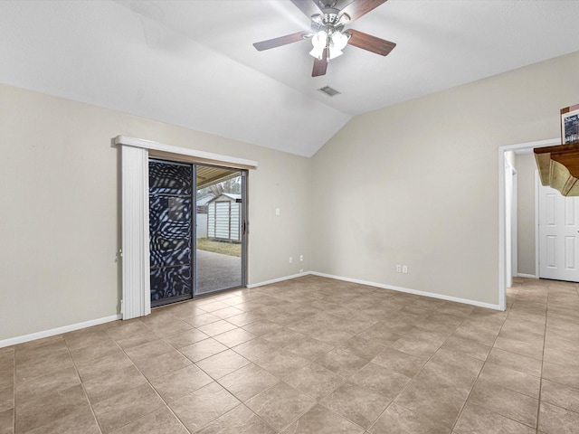 empty room with ceiling fan, visible vents, baseboards, and vaulted ceiling