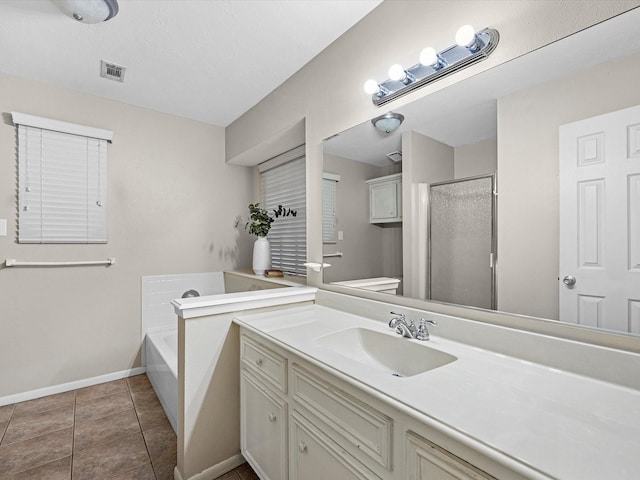 full bathroom with visible vents, toilet, tile patterned floors, vanity, and a bath