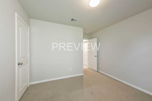 empty room with visible vents and baseboards