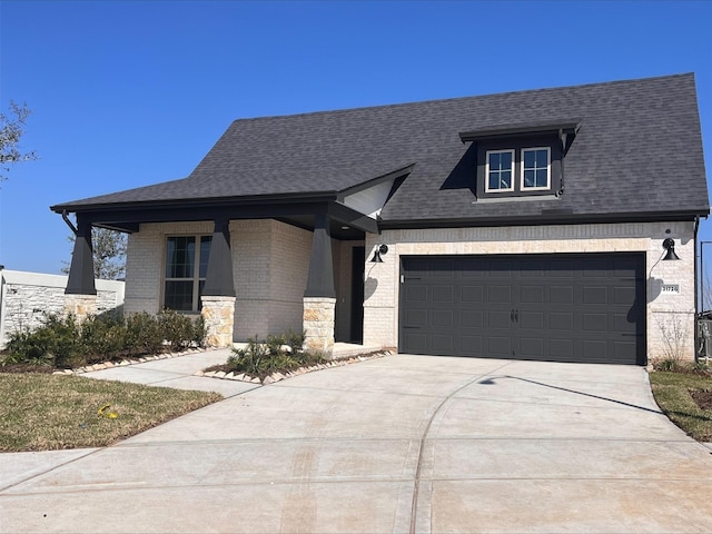 view of front of house with driveway, roof with shingles, and brick siding