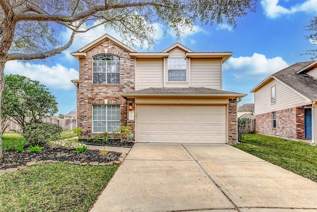 traditional-style home featuring driveway, an attached garage, fence, and brick siding