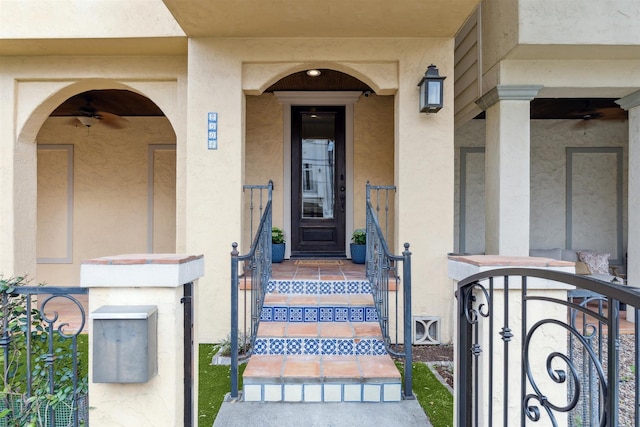 doorway to property featuring stucco siding