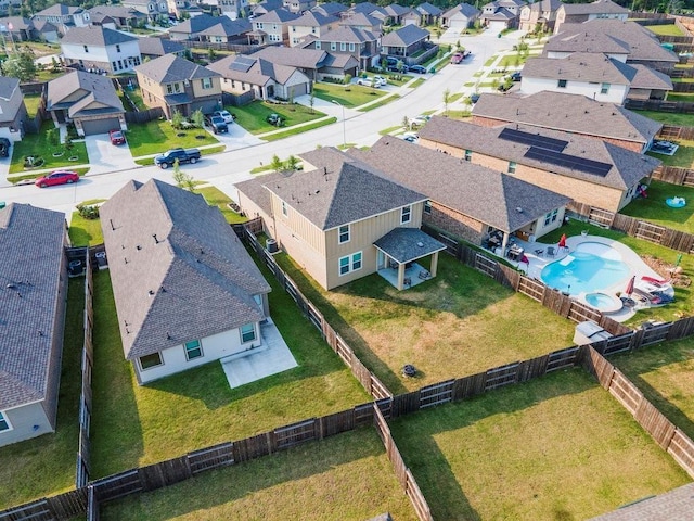 birds eye view of property with a residential view