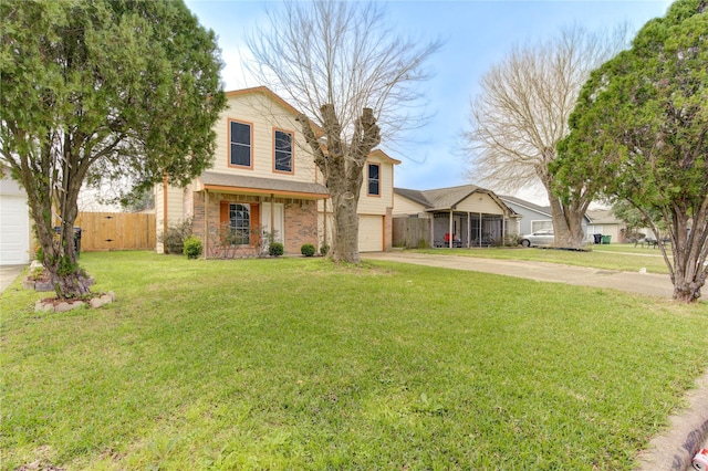 view of front of house with an attached garage, brick siding, fence, driveway, and a front yard