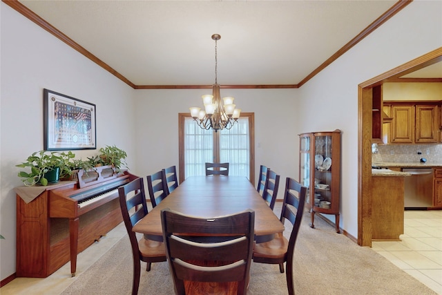 dining room with light tile patterned flooring, light colored carpet, a notable chandelier, baseboards, and crown molding