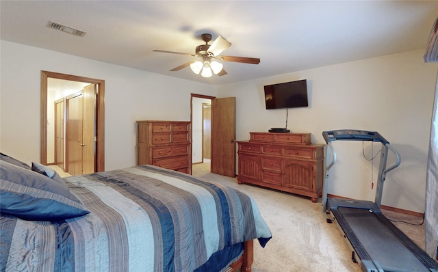 bedroom with a ceiling fan, light colored carpet, and visible vents