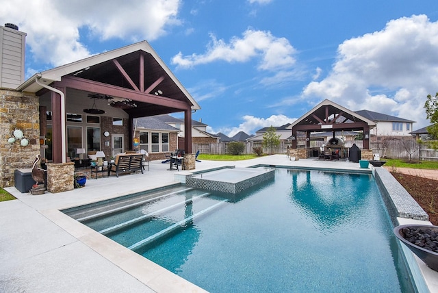 view of pool featuring ceiling fan, a fenced backyard, an in ground hot tub, a gazebo, and a fenced in pool