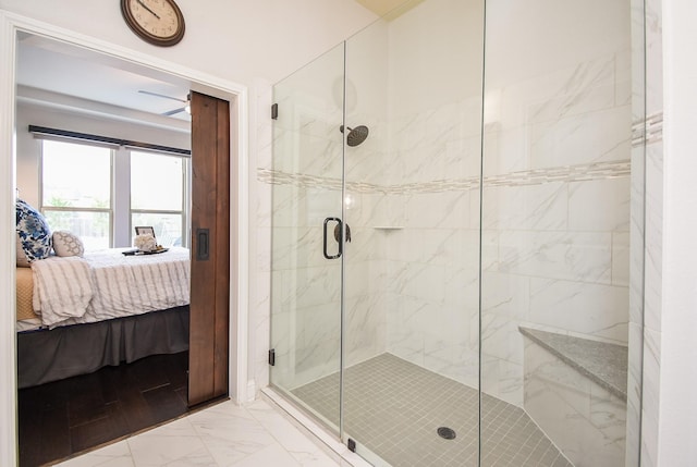 bathroom with marble finish floor, a marble finish shower, and connected bathroom