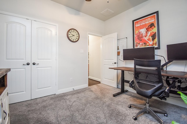 office featuring dark carpet and baseboards