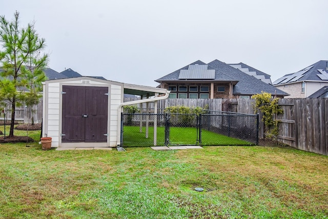 exterior space with a gate and a fenced backyard