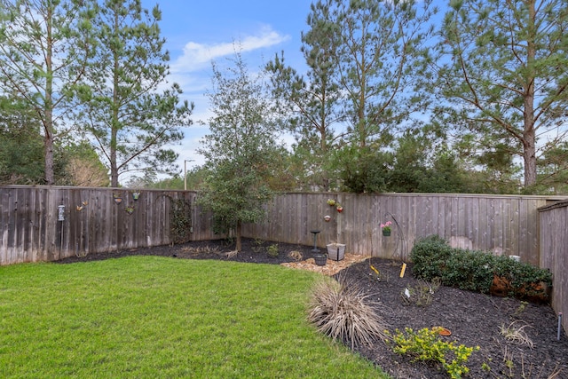 view of yard with a fenced backyard