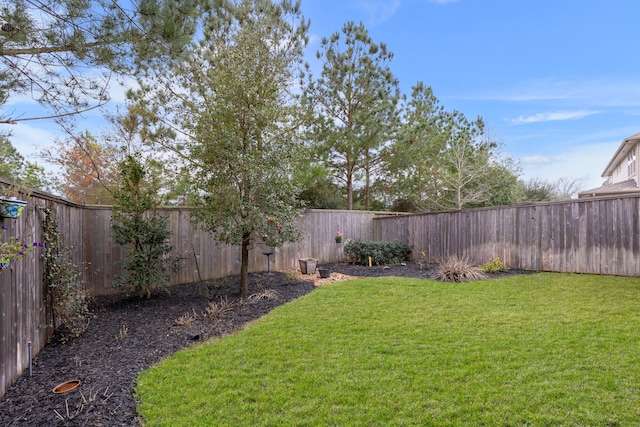 view of yard featuring a fenced backyard