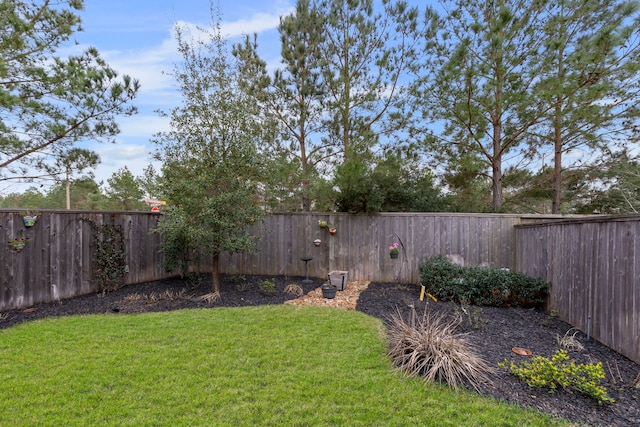 view of yard featuring a fenced backyard