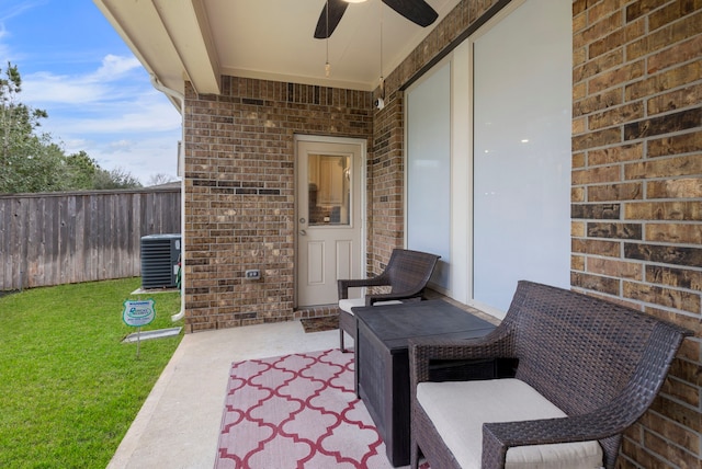 view of patio / terrace with ceiling fan, central AC unit, and fence