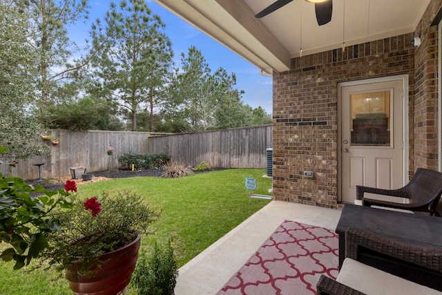 view of yard with ceiling fan, a patio, and a fenced backyard