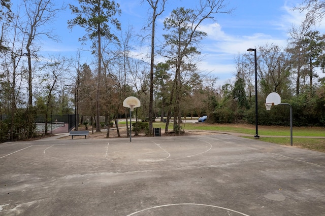 view of sport court with community basketball court and fence