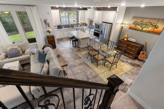 interior space with baseboards and visible vents