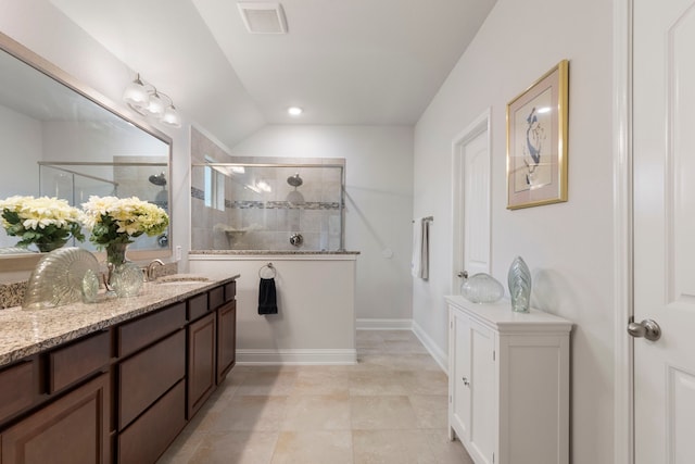 bathroom featuring recessed lighting, visible vents, vanity, tiled shower, and tile patterned floors