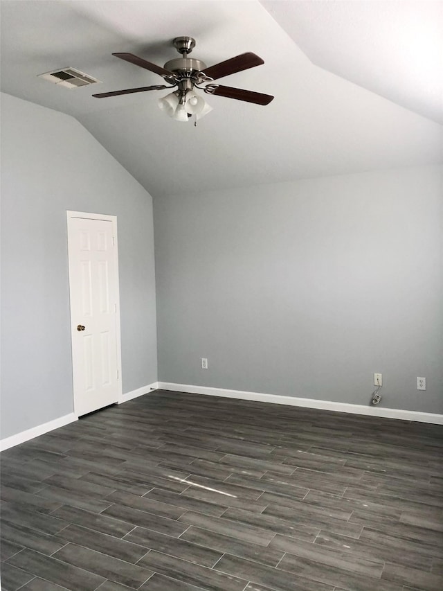 unfurnished room with visible vents, baseboards, lofted ceiling, ceiling fan, and dark wood-style flooring