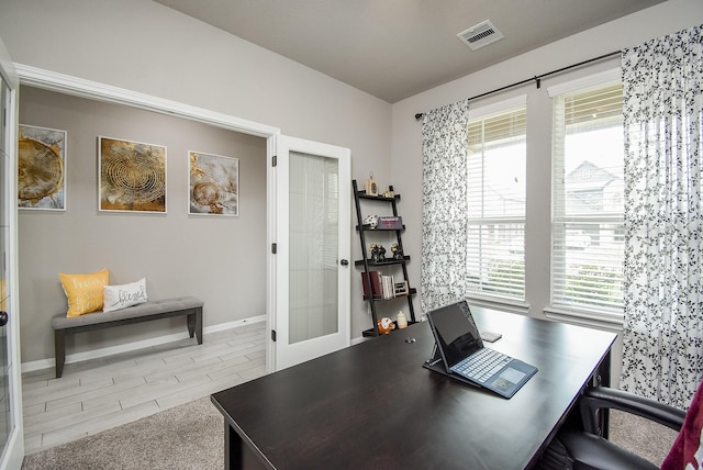 home office featuring french doors, visible vents, and baseboards